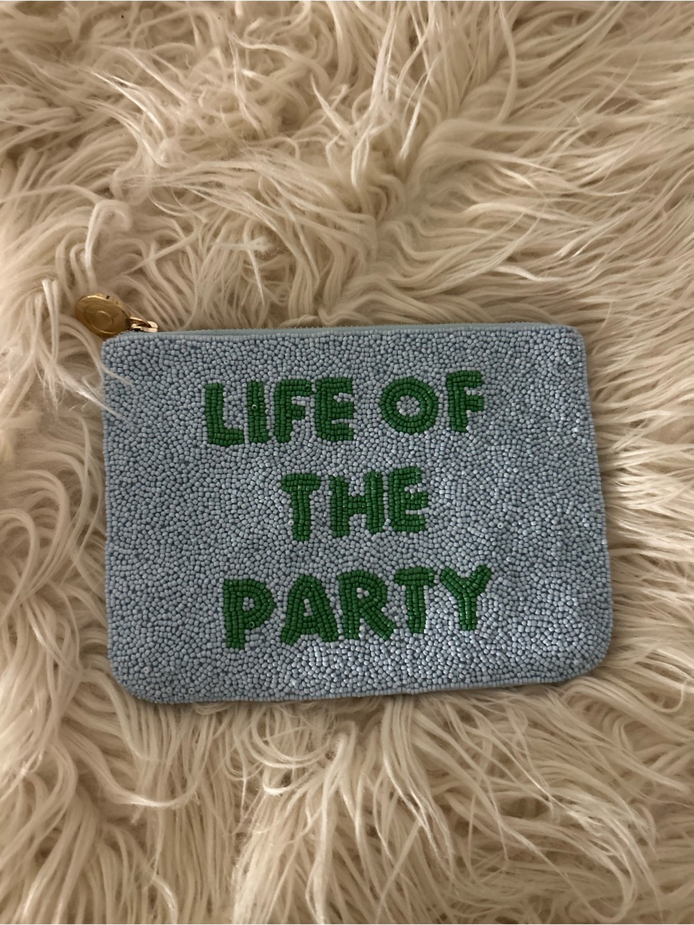 kate spade beaded pouch in light blue with green lettering